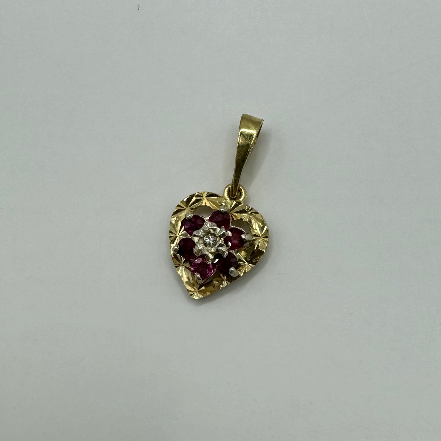 9ct 80s Diamond and garnet starburt heart charm