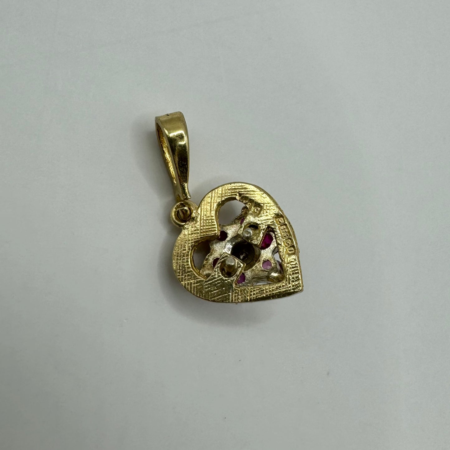 9ct 80s Diamond and garnet starburt heart charm